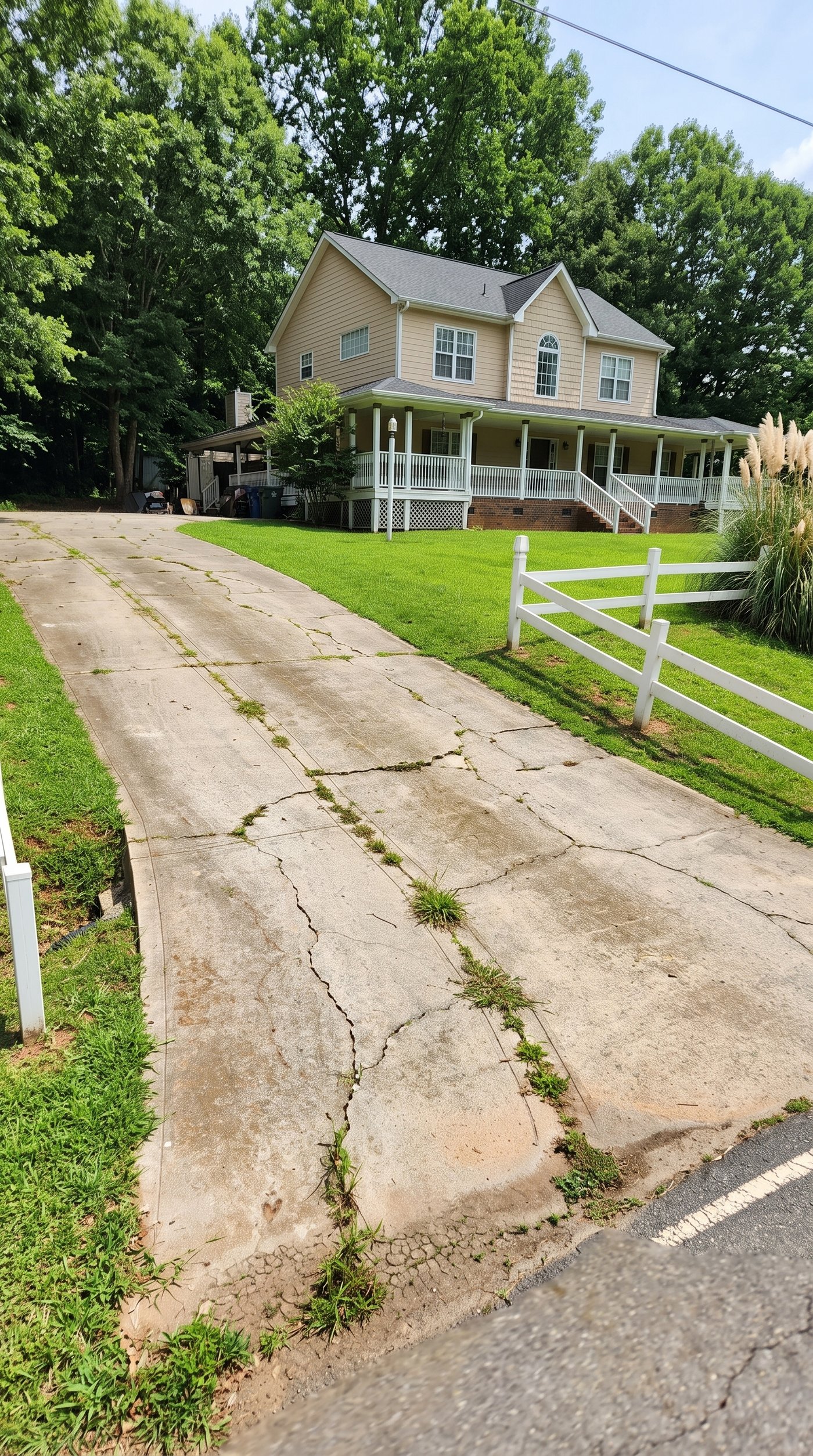 Old cracked driveway before removal