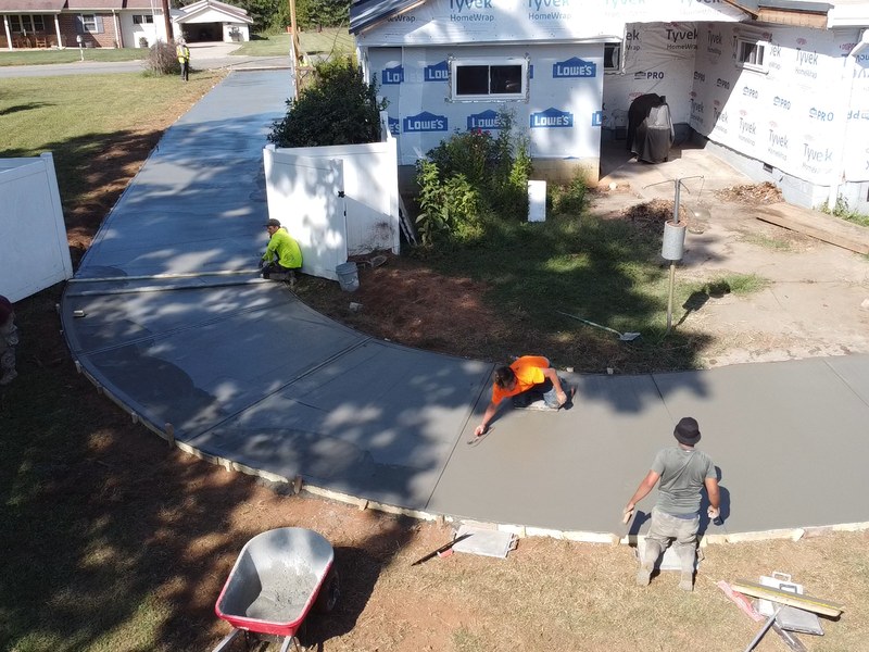 Long concrete driveway with proper drainage Huntersville NC - MCR Concrete